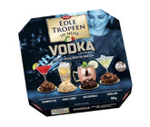 Edle Tropfen în Nuss Vodka Lounge 100g, praline de ciocolată umplute cu lichid, cu glazură de ciocolată cu lapte și bucăți crocante de alune de pădure