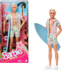 Păpușa Barbie Ken din filmul Barbie cu ținută de plajă în dungi roz pastel și verde, placă de surf și adidași albi, JBJ54