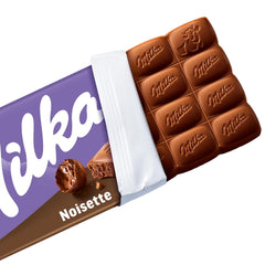 Milka Noisette – Ciocolată cu lapte alpină cu umplutură delicată și cremoasă de alune de pădure – 25 x 90g