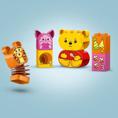 LEGO DUPLO - Disney Winnie the Pooh's Birthday Party - jucărie educativă pentru preșcolari - set cu 3 minifigurine, inclusiv Winnie the Pooh, Tigger și Piglet - idee de cadou pentru băieți și fete de la 1,5 ani 10457 Seturi de constructie Besuche den LEGO-Store