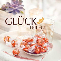 Bile de ciocolată Lindt LINDOR cu portocale roșii | Pungă resigilabilă de 1 kg | aprox. 80 de bomboane de ciocolată cu umplutură care se topește în gură | Pachet vrac, cadou de ciocolată