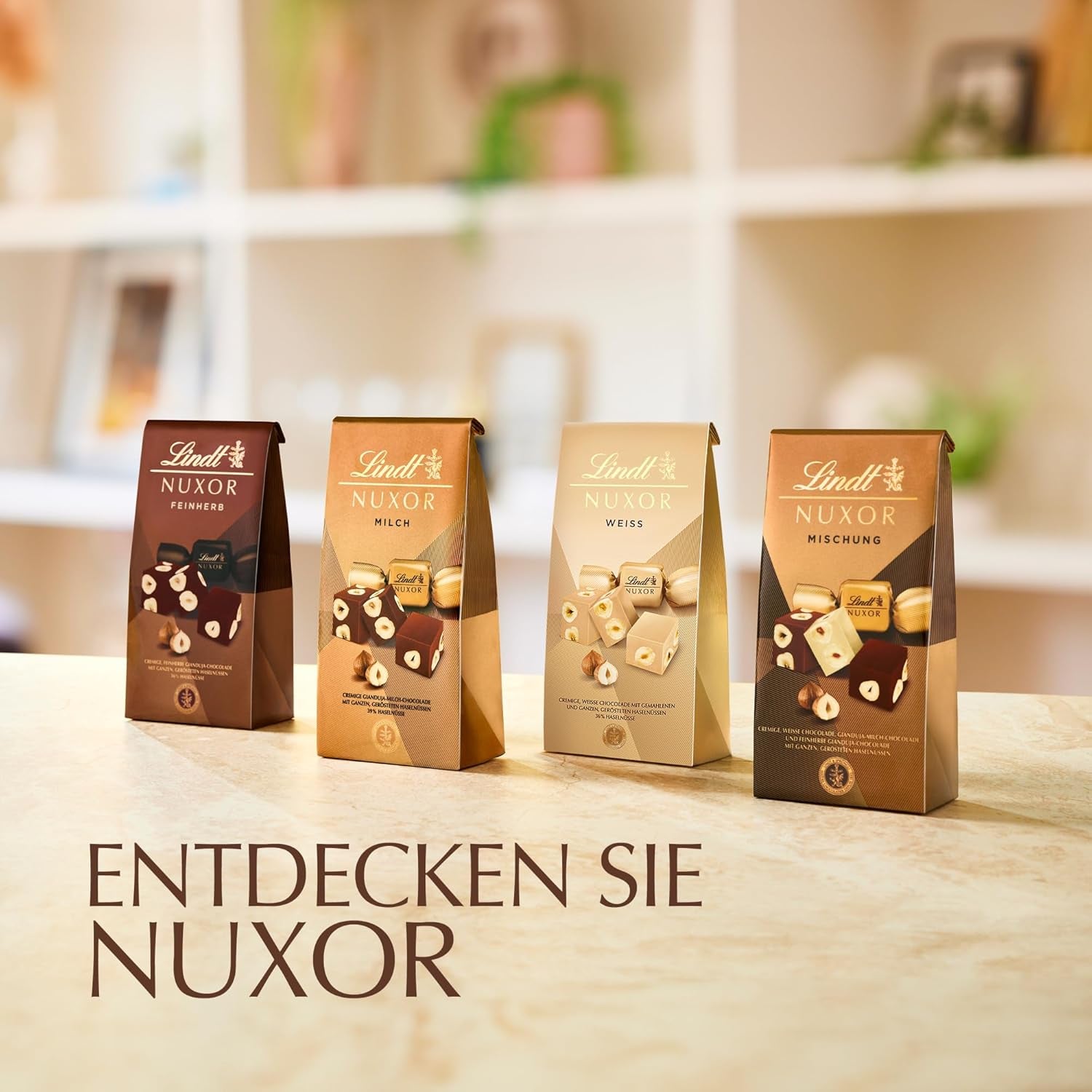 Ciocolată Lindt | Pliculeț de ciocolată cu lapte NUXOR | 103g | Cuburi cremoase de ciocolată cu lapte Gianduja cu alune de pădure prăjite | Cadou de ciocolată