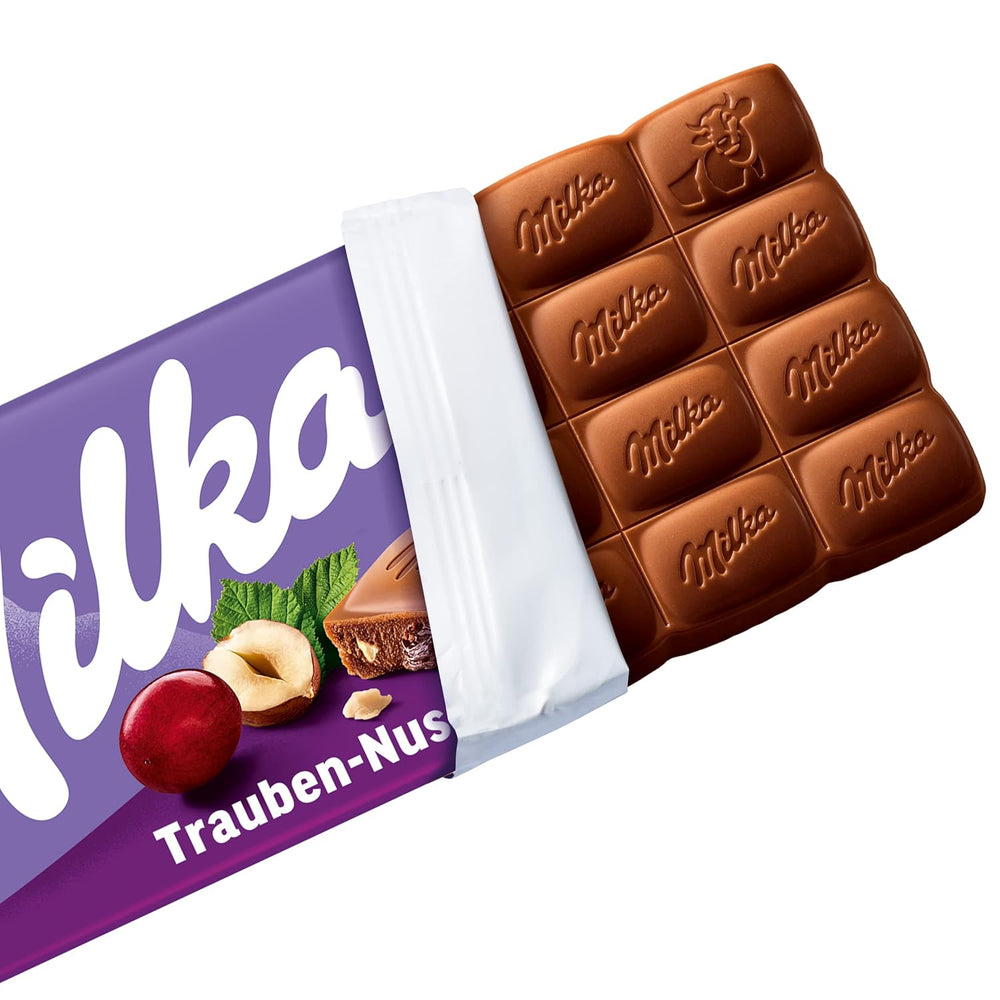 Milka Struguri și Alune – Ciocolată cu lapte alpină cu bucăți de alune și stafide – 90g