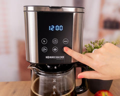 Espressor cu filtru Rommelsbacher FKM 1000 - rezervor de apă de 1,5 litri pentru 12 cești de cafea, carafă de sticlă, pornire cu întârziere, funcție de menținere la cald, funcție de aromă, suport detașabil pentru filtru 1x4