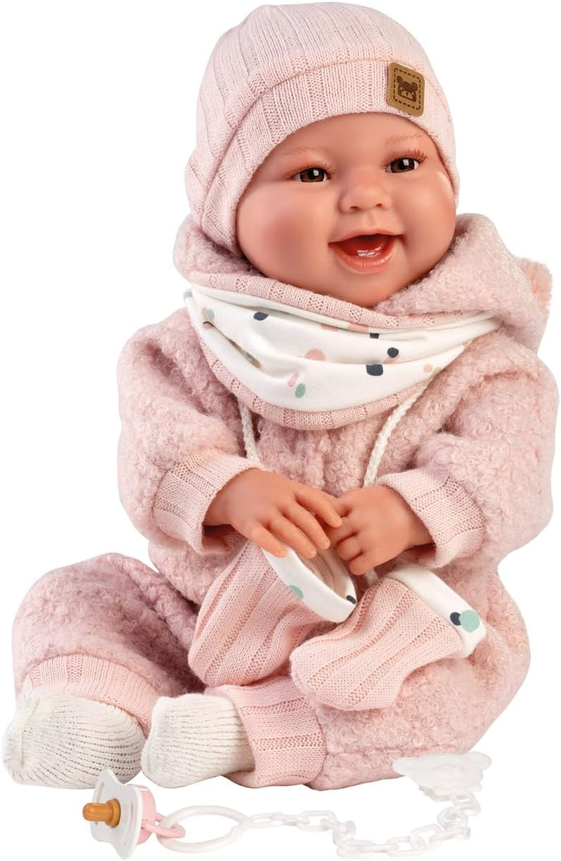 Llorens 1018480 Babypuppe Tala, mit braunen Augen und weichem Körper, Baby Puppe inkl. flauschigem rosa Winter-Outfit, Schnuller, Schnullerkette, 44 cm