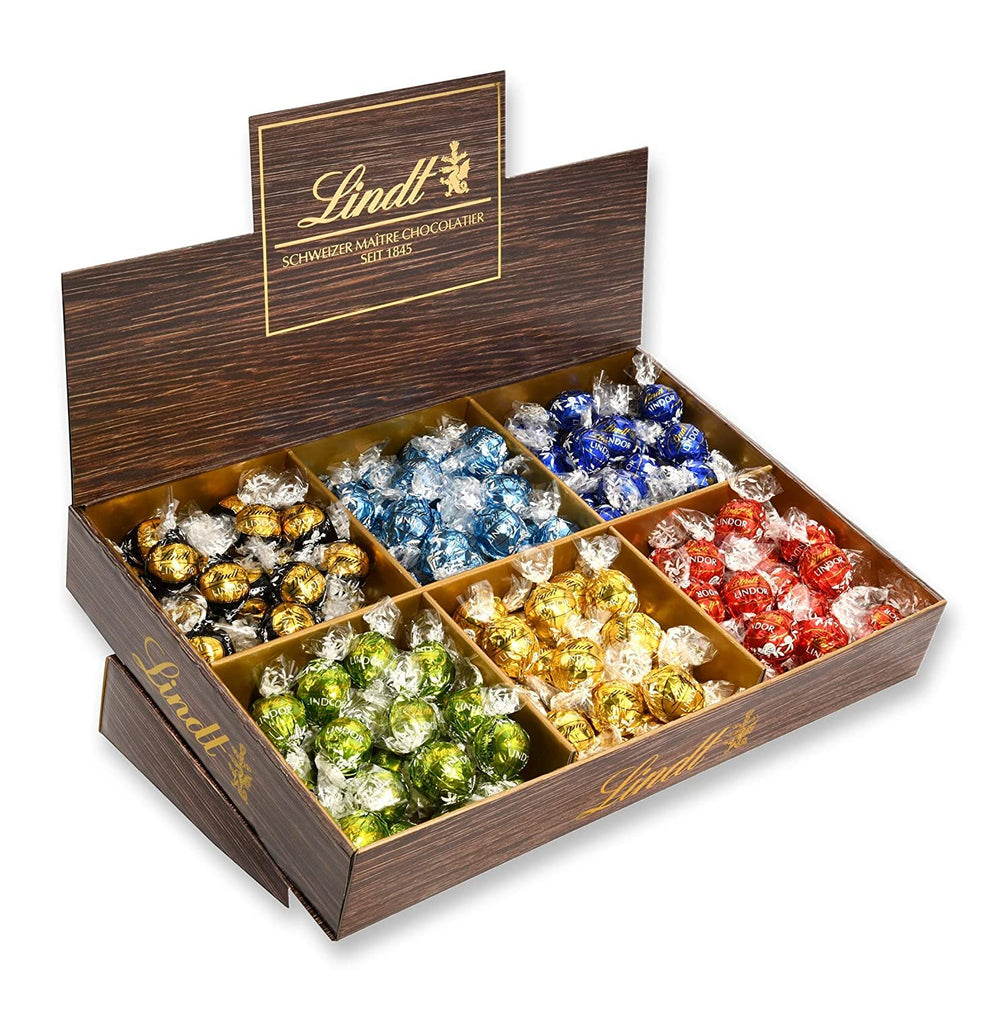 Prezentare de blat Lindor cu ciocolată | 1718 g și batoane de ciocolată cu marțipan | 25 batoane x 50 g într-un prezentare de blat | 1250 g | Marțipan pur acoperit cu ciocolată neagră | Batoane de ciocolată