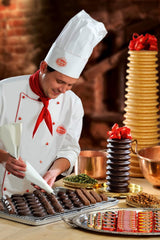 Aluat de ciocolată cu rom și fructe Reber, fructe îmbibate în rom pe marțipan fin, acoperite cu ciocolată neagră fină, 39g (1 bucată)