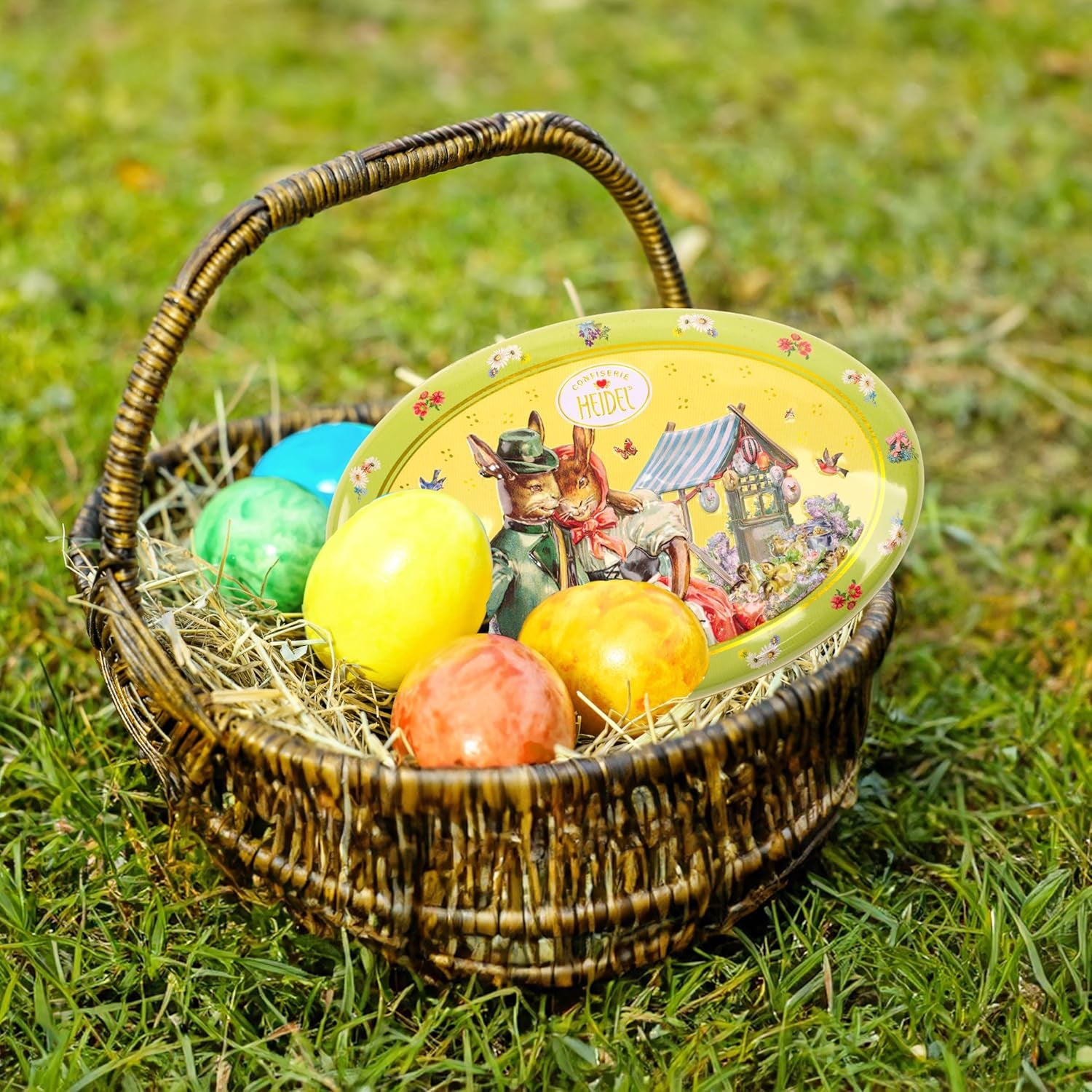 Cutie cadou Heidel cu felicitări de Paște 183g, praline premium din ciocolată cu lapte cu cutie metalică decorativă, ideală ca și cadou de Paște